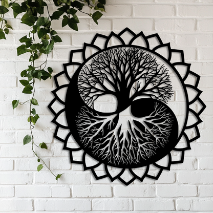Decorative wall art with a tree design inside a mandala on a white brick wall.
